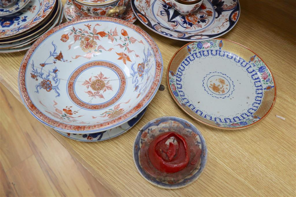 A collection of mixed Chinese and Japanese ceramics, mostly damaged